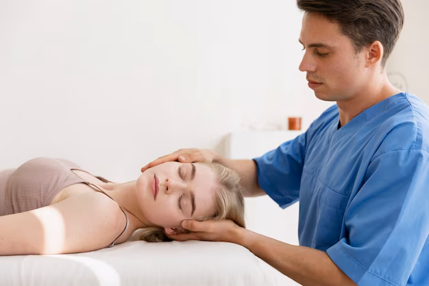 Doctor doing neck exercise to patient